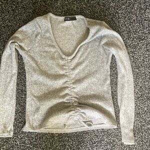 This is a gray long sleeve top. I’m selling it because it doesn’t fit anymore.